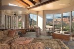 The living area is flooded with both light and panoramic framed views